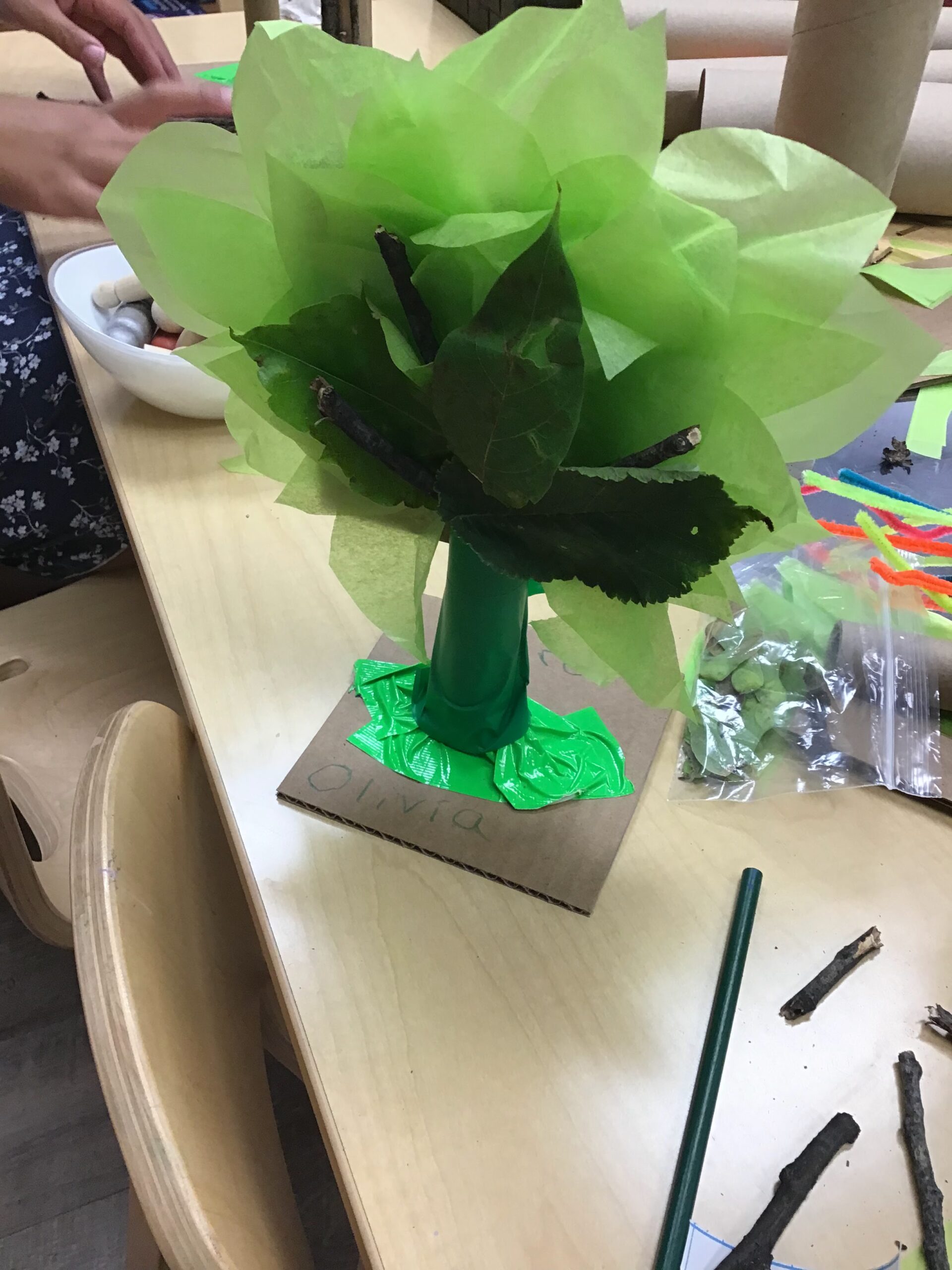 DIY tree craft made out of cardboard and leaves